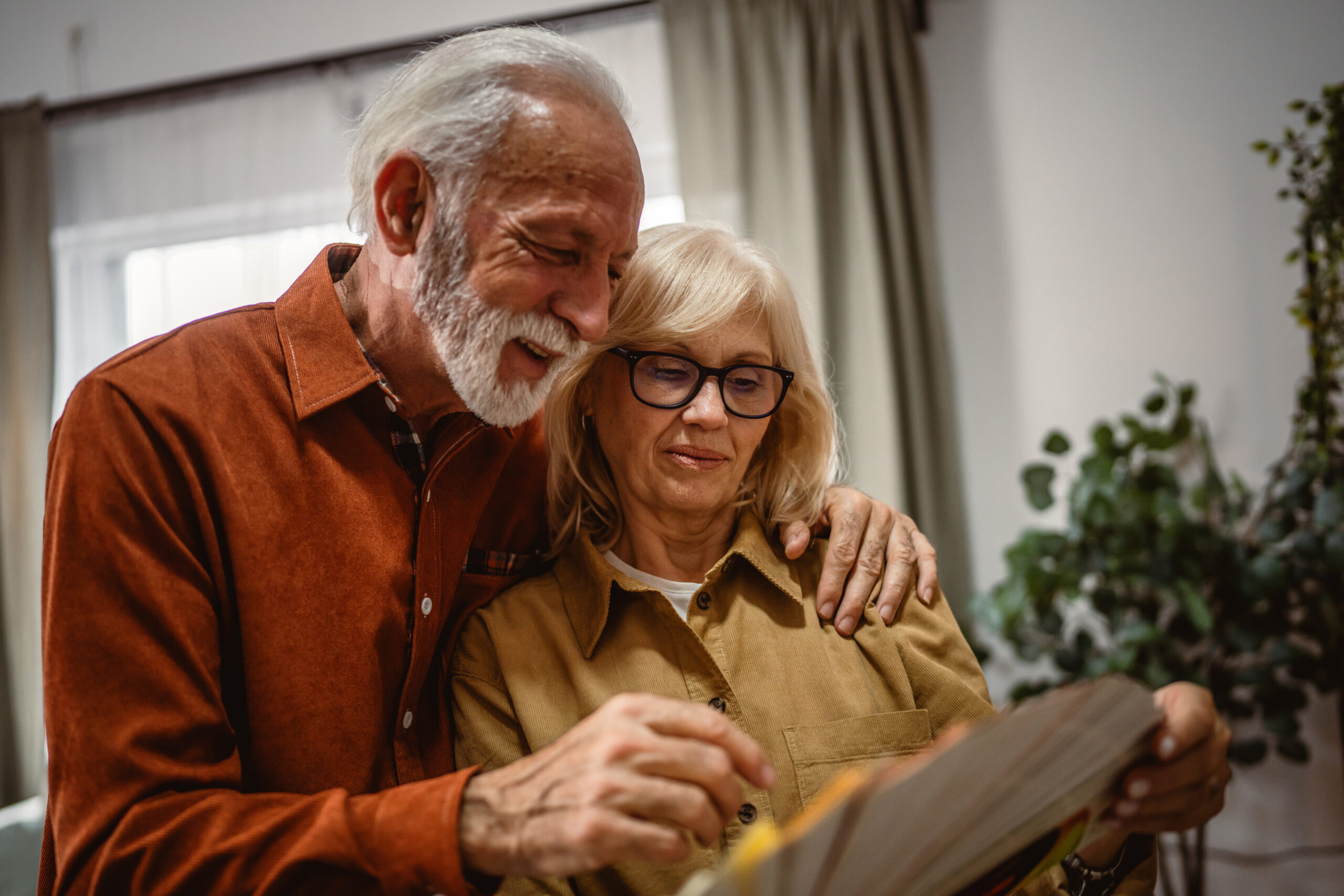 senior man and woman choice new color of wall from color palette